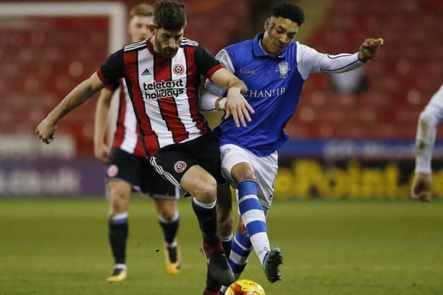 Ched Evans of Sheffield United and Sean Clare of Sheffield Wednesday: Simon Bellis/Sportimage