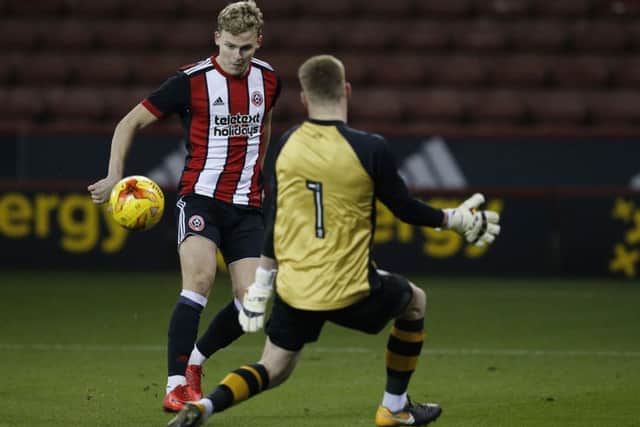 Jake Wright of Sheffield United clips the ball past Dan Wallis of Sheffield Wednesday - only for it to be ruled offside: Simon Bellis/Sportimage