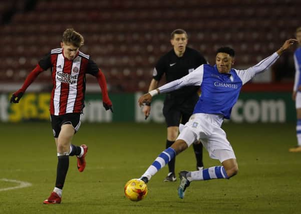David Brooks of Sheffield United tackled by Sean Clare of Sheffield Wednesday: Simon Bellis/Sportimage