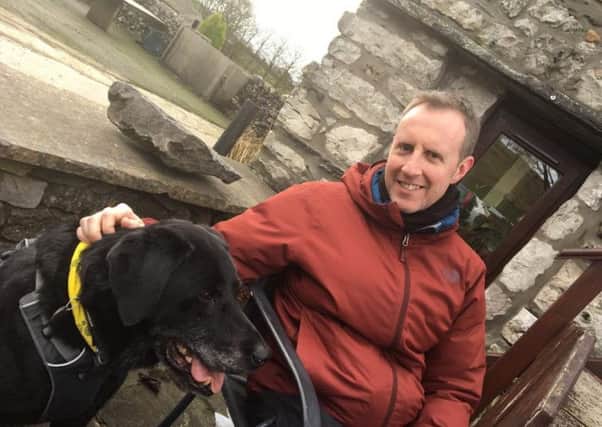 og-lover Nick White, aged 43, from High Storrs, Sheffield, has raised Â£1,500 for the Support Dogs charity by giving up alcohol for a year. He is pictured with his dog, black Labrador Sam.