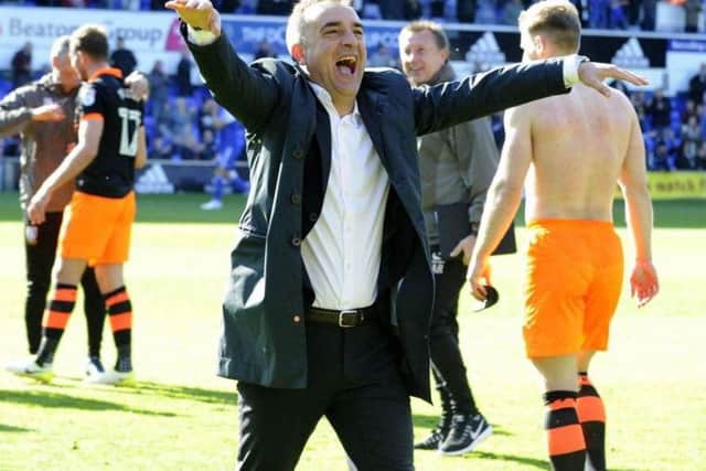 Carlos Carvalhal salutes the Sheffield Wednesday fans after securing a place in the play-offs last season