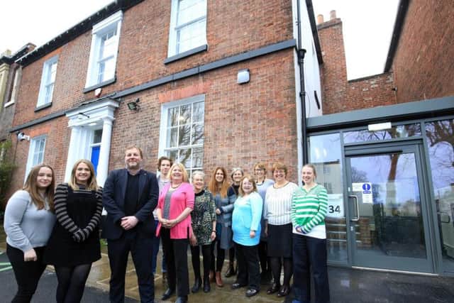 Chris Farrell with Cavendish Cancer Care staff outside the new centre on Wilkinson Street, Broomhall. Picture: Chris Etchells