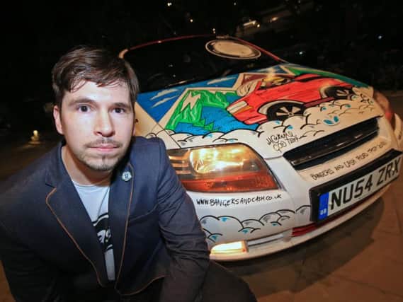 Artist Matt Cockayne, with the artwork he has created for the Bangers and Cash rally