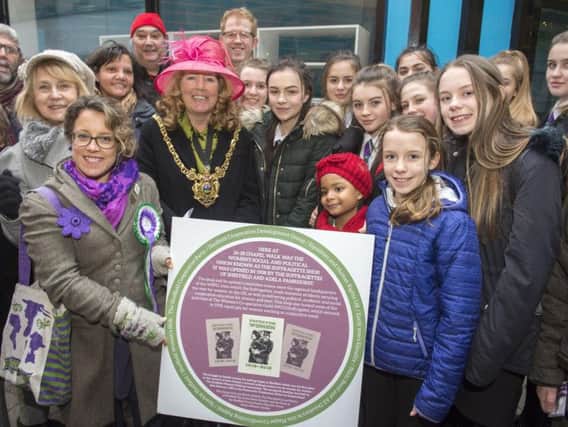 Lord Mayor of Sheffield Cllr Ann Murphy reveals the plaque that will go outside the shop on Chapel Walk where the Sufrrogette movement met in the city.