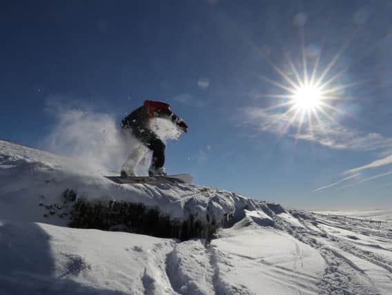 A snowboarder on the Cumbria Durham border makes the most of the snow