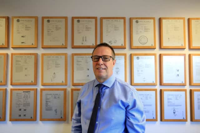David Amory with some of AESSEAL's more than 50 patents. Picture: Chris Etchells