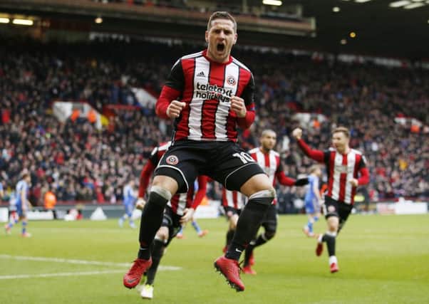 Billy Sharp celebrates scoring his second goal from the penalty spot against Leeds United