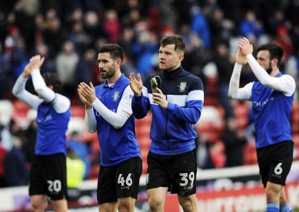 Owls players applaud fans at the final whistle at Oakwell....Pic Steve Ellis