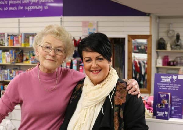 Pauline Higbid, aged 82, who has raised over Â£20,000 for Bluebell Woods Childrens Hospice, has celebrated ten years as a volunteer. She is pictured with racey Woolsey, Manager of Bluebell Woods Sheffield shop.
