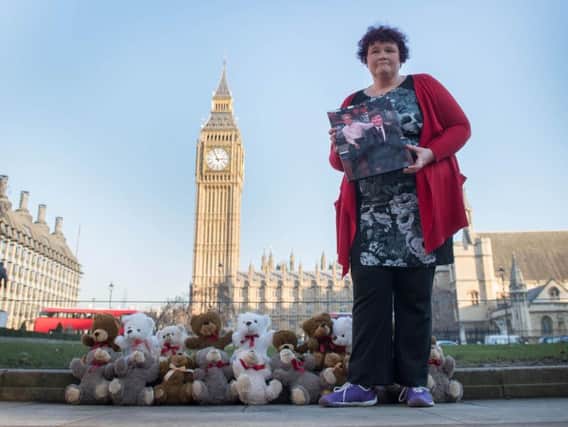 Claire Throssell, whose children were killed by her abusive ex-husband in 2014, lays 20 teddy bears in Westminster symbolising the children who have died as a result of unsafe child contact with a parent who is a perpetrator of domestic abuse.