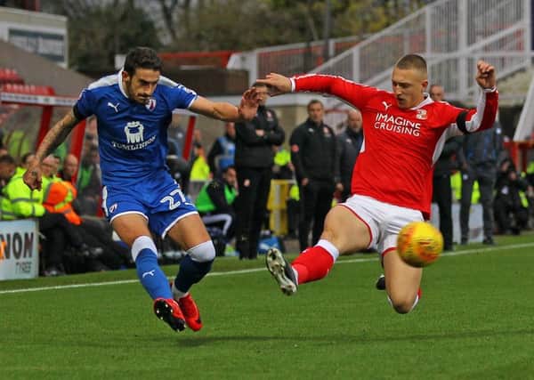 Picture by Gareth Williams/AHPIX.com; Football; Sky Bet League Two; Swindon Town v Chesterfield FC; 11/11/2017 KO 15.00; The Energy Check County Ground; copyright picture; Howard Roe/AHPIX.com; Bradley Barry fires in a cross despite the attentions of Luke Norris