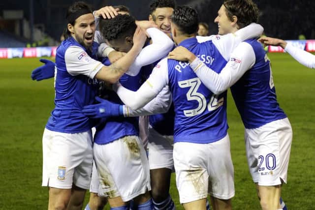 Sheffield Wednesday players celebrate after Lucas Joao fired in his second against Derby County
