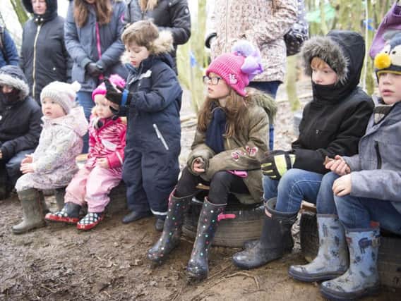 Muddy Puddles Harry Potter adventure day at Mosborough Woods
Story time round the camp fire. Picture: Dean Atkins.