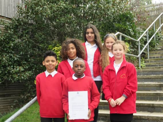 Pupils at St Anns Grove Primary, in Sheffield, with the letter from Nick Gibb