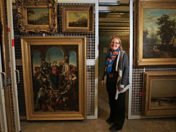 Sian Brown with paintings in Museums Sheffield's store. Picture: Chris Etchells