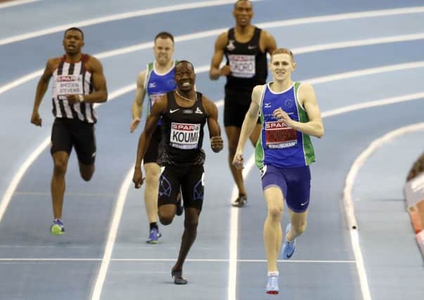 Lee Thompson (right) wins the Men's 400m final during day two of the SPAR British Indoor Athletics Championships at Arena Birmingham. Martin Rickett/PA Wire.