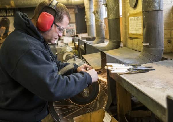 Cutler Paul Weatherstone grinding blades at Chimo Holdings based at White Rose Works, Sheffield. Pic Dean Atkins.