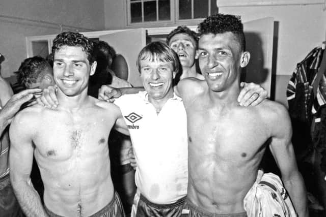 Dave Bassett celebrates promotion with players after beating Leicester City