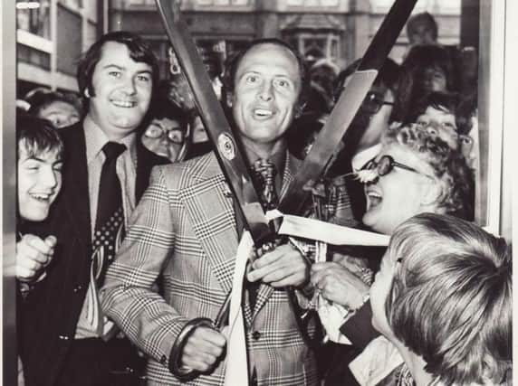 Geoffrey Boycott with the giant scissors that were loaned out for ribbon-cutting ceremonies.