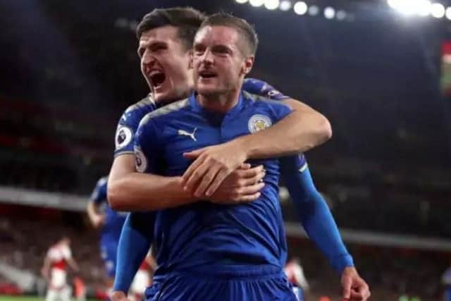 Harry Maguire celebrates with Leicester City teammate Jamie Vardy