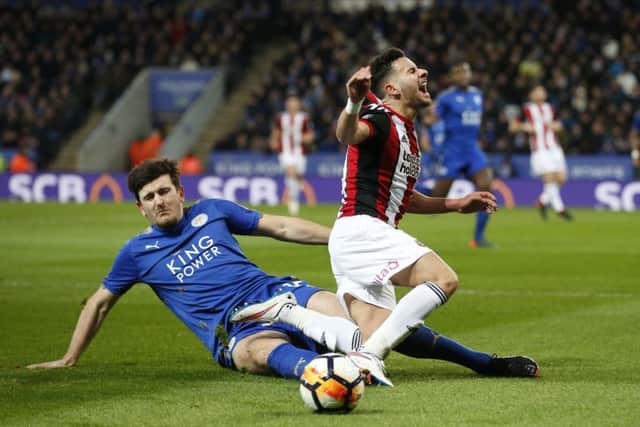 Harry Maguire of Leicester City  tackles George Baldock of Sheffield Utd during the FA cup fifth round match at the King Power Stadium, Leicester.Simon Bellis/Sportimage