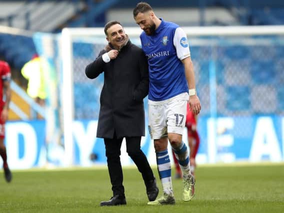 Swansea City boss Carlos Carvalhal with his former player, Sheffield Wednesday striker Atdhe Nuhiu. Pic: SportImage