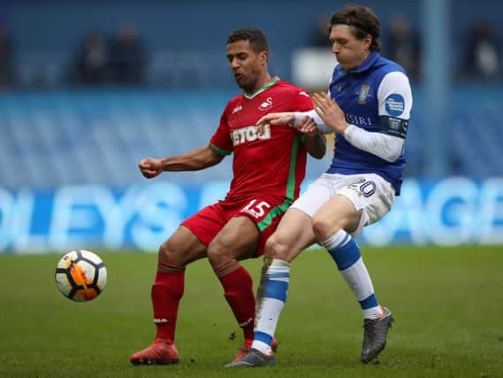 Adam Reach challenges Wayne Routledge during the 0-0 draw between Sheffield Wednesday and Swansea at Hillsborough