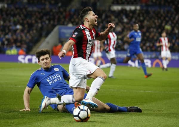 Harry Maguire of Leicester City challenges George Baldock of Sheffield Utd Simon Bellis/Sportimage