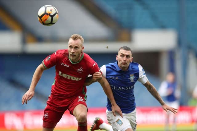 Jack Hunt in action for the Owls against Swansea