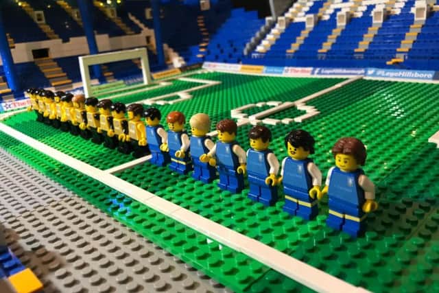 The teams line up on the pitch at Lego Hillsborough.
