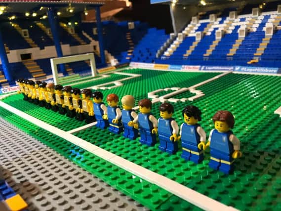 The teams line up on the pitch at Lego Hillsborough.
