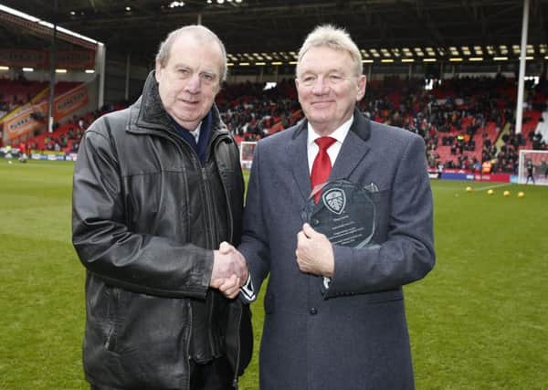 Peter Lorimer presents Tony Currie with an award before Leeds' recent visit to Bramall Lane: Simon Bellis/Sportimage