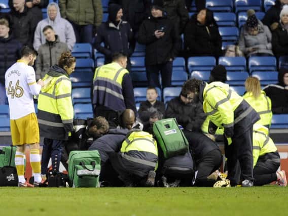 Jordan Thorniley receives treatment on the pitch