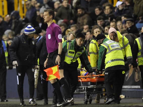 Jordan Thorniley is stretchered off after suffering injury at Millwall