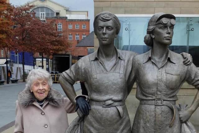 Audrey beside the Women of Steel statue in Sheffield city centre