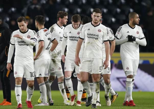 Sheffield United players leave the pitch dejected after defeat to Hull City