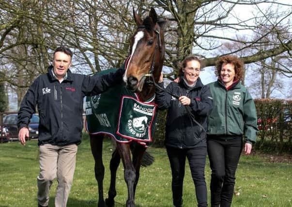 One For Arthur back home after his Grand National triumph at Aintree last year. He is flanked by trainer Lucinda Russell, her partner, former champion jockey Peter Scudamore, and groom Jaimie Duff.