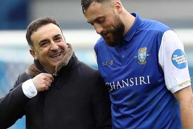 Former Owls chief Carlos Carvalhal and striker Atdhe Nuhiu in the special Sheffield Children's Hospital shirt. Picture: Lynne Cameron/SportImage
