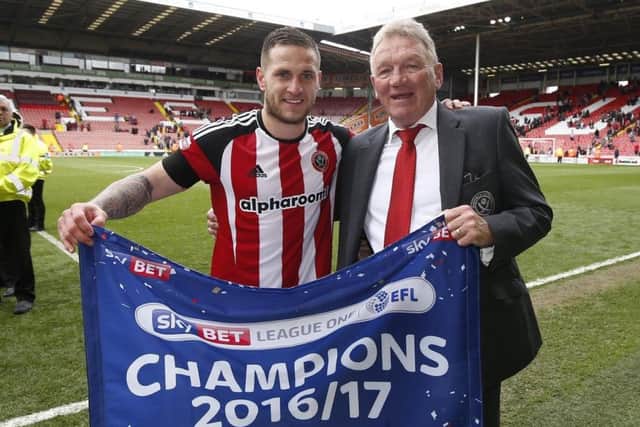 Celebrating the League One title last season with Billy Sharp
