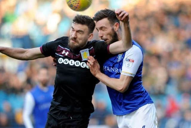 Robert Snodgrass challenges for the ball with Morgan Fox