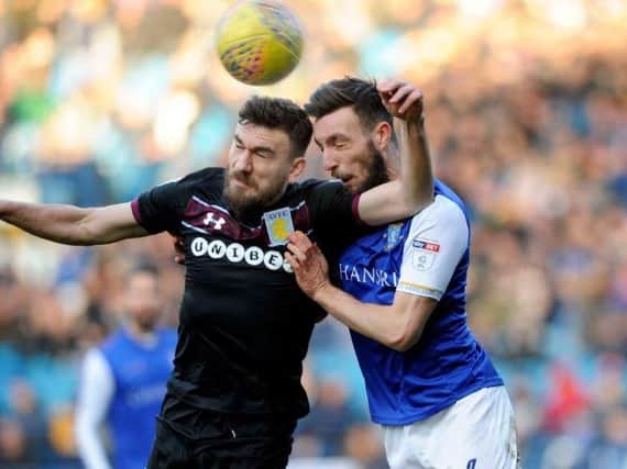 Robert Snodgrass challenges for the ball with Morgan Fox