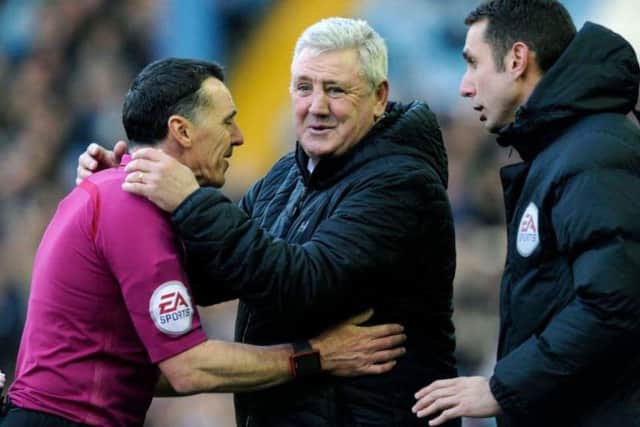 Steve Bruce shares a joke with referee Neil Swarbrick during Aston Villa's 4-2 win at Sheffield Wednesday