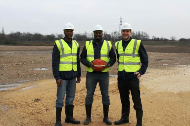 Players at the site before work began, with head coach Atiba Lyons pictured centre.