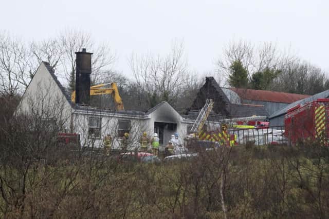 The remains of the house following the fire, which claimed at least three lives (photo: Brian Lawless/PA Wire)