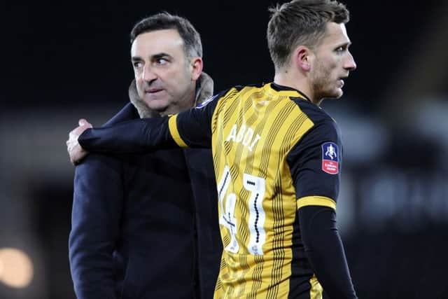 Swans boss Carlos Carvalhal with Almen Abdi at the final whistle.....Pic Steve Ellis