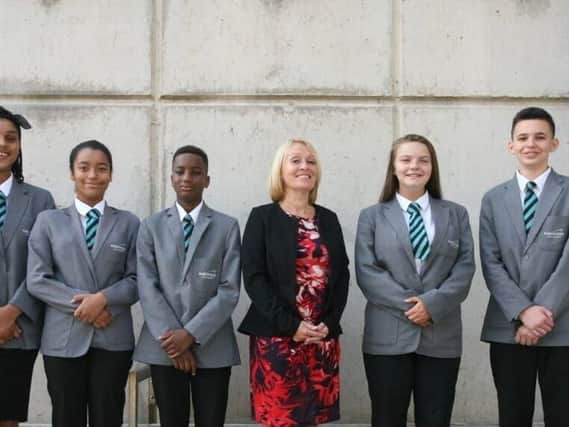 Parkwood E-Act Academy headteacher Vicky Simcock celebrates the Ofsted report with pupils