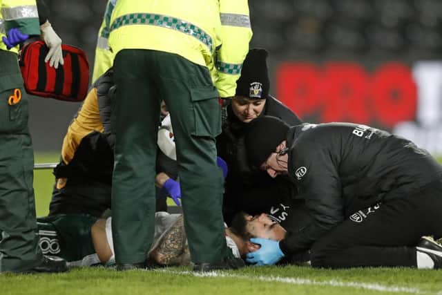 Barnsley's Adam Jackson is treated on the pitch during the Sky Bet Championship match at the KCOM Stadium, Hull. PRESS ASSOCIATION Photo.