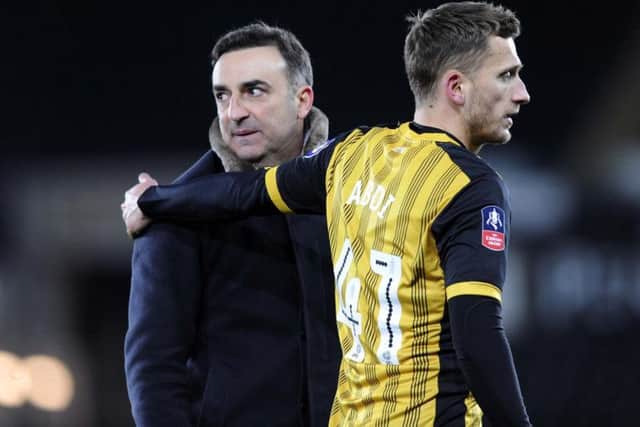 Former Sheffield Wednesday boss Carlos Carvalhal with Owls midfielder Almen Abdi following a 2-0 win for Swansea City in the FA Cup.