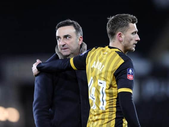 Former Sheffield Wednesday boss Carlos Carvalhal with Owls midfielder Almen Abdi following a 2-0 win for Swansea City in the FA Cup.