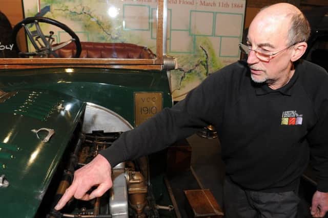 Engineer Keith Wall looks inside the 1908 Sheffield-Simplex car at Kelham Island Museum. Picture: Andrew Roe